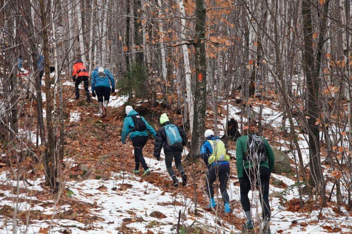 Runners negotiate a snow-dusted course